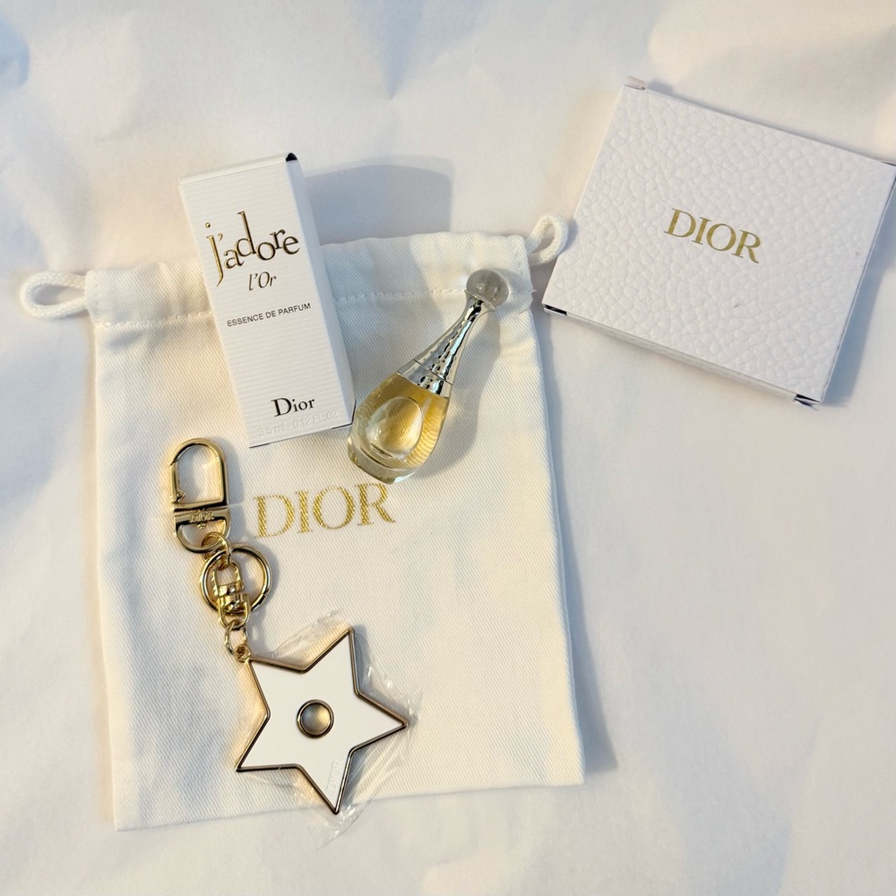 Dior J'adore Essence Mini with Dior Gold Star Keychain bag charm.